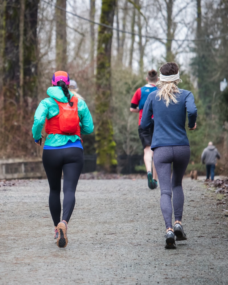 A group jogging together along a park path