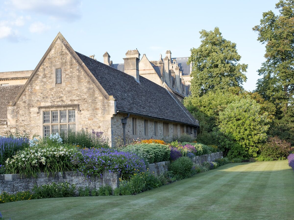 Stone house with a lavender border and lawn
